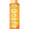 Huile bronzante visage et corps haute protection SPF50 Nuxe Sun