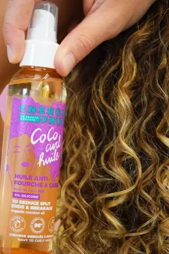 Huile coiffante anti-fourche pour cheveux bouclés